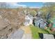 Aerial view showcases a well-maintained two-story home with a detached garage and a spacious, well-kept lawn at 422 N Oxford St, Indianapolis, IN 46201