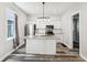 Updated kitchen with stainless steel appliances, granite countertops, and a stylish island at 422 N Oxford St, Indianapolis, IN 46201