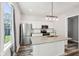 Updated kitchen with stainless steel appliances, granite countertops, and a stylish island at 422 N Oxford St, Indianapolis, IN 46201