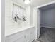 Laundry area features storage cabinets and natural light from a nearby window at 422 N Oxford St, Indianapolis, IN 46201
