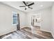 Open living room with new floors, natural light, and view into the updated kitchen at 422 N Oxford St, Indianapolis, IN 46201