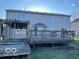 Large wooden backyard deck and home exterior, perfect for enjoying the outdoors at 480 Village Blvd, Mooresville, IN 46158