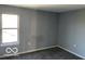 Bedroom features a neutral walls, carpeted floors and a window that allows natural light at 480 Village Blvd, Mooresville, IN 46158