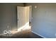 Bedroom featuring neutral walls, carpet flooring, and doorway at 480 Village Blvd, Mooresville, IN 46158