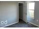 Bedroom featuring neutral walls, carpet flooring, and closet at 480 Village Blvd, Mooresville, IN 46158