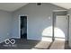 Bedroom with neutral walls, carpet flooring, a doorway with view into another room at 480 Village Blvd, Mooresville, IN 46158