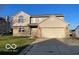 Charming two-story home featuring a two-car garage, brick accents, and well-maintained landscaping at 480 Village Blvd, Mooresville, IN 46158