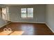 Entry way into living room with neutral walls and natural light at 480 Village Blvd, Mooresville, IN 46158