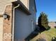 Exterior view showcasing the home's siding and brickwork, highlighting its architectural details at 480 Village Blvd, Mooresville, IN 46158
