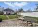 Lush backyard with a combination of stone patio and grassy areas, ideal for relaxing and gathering at 4815 Winthrop Ave, Indianapolis, IN 46205