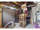 A view of a messy unfinished basement with lots of storage and random items at 4815 Winthrop Ave, Indianapolis, IN 46205