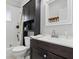 Well-lit bathroom with a vanity, mirror, and tiled shower at 4815 Winthrop Ave, Indianapolis, IN 46205