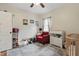 Cozy Bedroom with a crib, changing table, and comfortable seating area at 4815 Winthrop Ave, Indianapolis, IN 46205