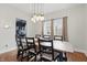 Stylish dining room features hardwood floors, a wooden table, and modern pendant lighting at 4815 Winthrop Ave, Indianapolis, IN 46205