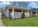 Charming home with a welcoming porch and well-manicured lawn at 4815 Winthrop Ave, Indianapolis, IN 46205