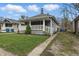 Charming home with a welcoming porch and well-manicured lawn at 4815 Winthrop Ave, Indianapolis, IN 46205