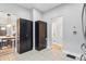 Kitchen featuring dark cabinets and access to additional storage and dining areas at 4815 Winthrop Ave, Indianapolis, IN 46205