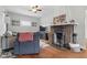 Comfortable living room featuring a decorative brick fireplace and ample seating, creating a cozy atmosphere at 4815 Winthrop Ave, Indianapolis, IN 46205