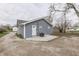 Backyard features a gravel area, concrete patio, and access to the home's rear entrance at 4945 Camden St, Indianapolis, IN 46227