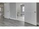 Bathroom features white marble floors and a toilet in a well-lit, modern space at 4945 Camden St, Indianapolis, IN 46227