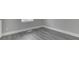 Neutral bedroom flooring with gray wood-look vinyl and bright white trim at 4945 Camden St, Indianapolis, IN 46227