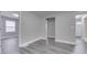 A freshly painted hallway featuring attractive gray vinyl floors and modern recessed lighting at 4945 Camden St, Indianapolis, IN 46227