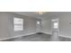Inviting living room features gray flooring, neutral paint, and ample natural light at 4945 Camden St, Indianapolis, IN 46227