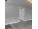 Bright, freshly painted living space with gray vinyl floors and recessed lighting at 4945 Camden St, Indianapolis, IN 46227