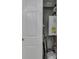 A small utility closet featuring a hot water heater and all of its connections at 4945 Camden St, Indianapolis, IN 46227