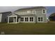 Backyard featuring a covered patio and ample windows for natural light at 4952 Cinnabar Trl, Brownsburg, IN 46112