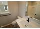 Bathroom featuring sleek fixtures, modern vanity, and a shower with glass doors at 4952 Cinnabar Trl, Brownsburg, IN 46112