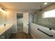 This bathroom features modern fixtures and finishes with an opening to the shower at 4952 Cinnabar Trl, Brownsburg, IN 46112