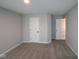 Neutral bedroom with plush carpet, neutral walls, white doors, baseboards, and recessed lighting at 4952 Cinnabar Trl, Brownsburg, IN 46112