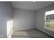Empty bedroom with plush carpeting, neutral paint, and a sunlit window at 4952 Cinnabar Trl, Brownsburg, IN 46112