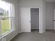 Bedroom with large window for natural light and closet with sliding door at 4952 Cinnabar Trl, Brownsburg, IN 46112