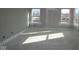 Bedroom space with large windows providing ample sunlight, neutral walls, and clean design at 4952 Cinnabar Trl, Brownsburg, IN 46112