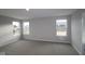 This bedroom has neutral walls and carpet with views from three windows at 4952 Cinnabar Trl, Brownsburg, IN 46112