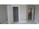 View of a bedroom featuring painted walls, white trim and two open doorways to other rooms at 4952 Cinnabar Trl, Brownsburg, IN 46112