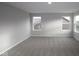 This bedroom has neutral walls and carpet with views from two windows at 4952 Cinnabar Trl, Brownsburg, IN 46112