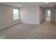 This room has neutral walls and carpet with a door to another room at 4952 Cinnabar Trl, Brownsburg, IN 46112