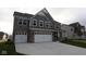 Charming two-story home boasting stone and shingle siding, a two-car garage, and a wide driveway at 4952 Cinnabar Trl, Brownsburg, IN 46112