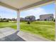 Expansive backyard view from the covered patio, showcasing neighboring homes and green space at 4960 Cinnabar Trl, Brownsburg, IN 46112