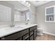 Bathroom features a dual sink vanity with dark cabinets and white countertop at 4960 Cinnabar Trl, Brownsburg, IN 46112