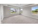 Spacious bedroom features plush carpet, neutral walls, tray ceiling, and natural light from multiple windows at 4960 Cinnabar Trl, Brownsburg, IN 46112