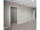 A well-lit bedroom with a view into a walk-in closet, showcasing ample storage at 4960 Cinnabar Trl, Brownsburg, IN 46112