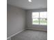 This bedroom features neutral walls, carpet flooring and a window letting in natural light at 4960 Cinnabar Trl, Brownsburg, IN 46112