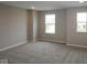This bedroom features neutral walls, carpet flooring and two windows letting in plenty of natural light at 4960 Cinnabar Trl, Brownsburg, IN 46112