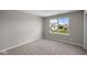 Bright bedroom with a large window, filling the room with natural light and outdoor views at 4960 Cinnabar Trl, Brownsburg, IN 46112