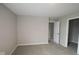 This bedroom features neutral walls, carpet flooring and an open closet at 4960 Cinnabar Trl, Brownsburg, IN 46112