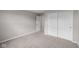 Bedroom features neutral walls, carpet flooring, and closet with sliding doors at 4960 Cinnabar Trl, Brownsburg, IN 46112